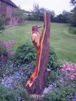 customer Wildlife wood-carvings, root sculptures and water features in situ